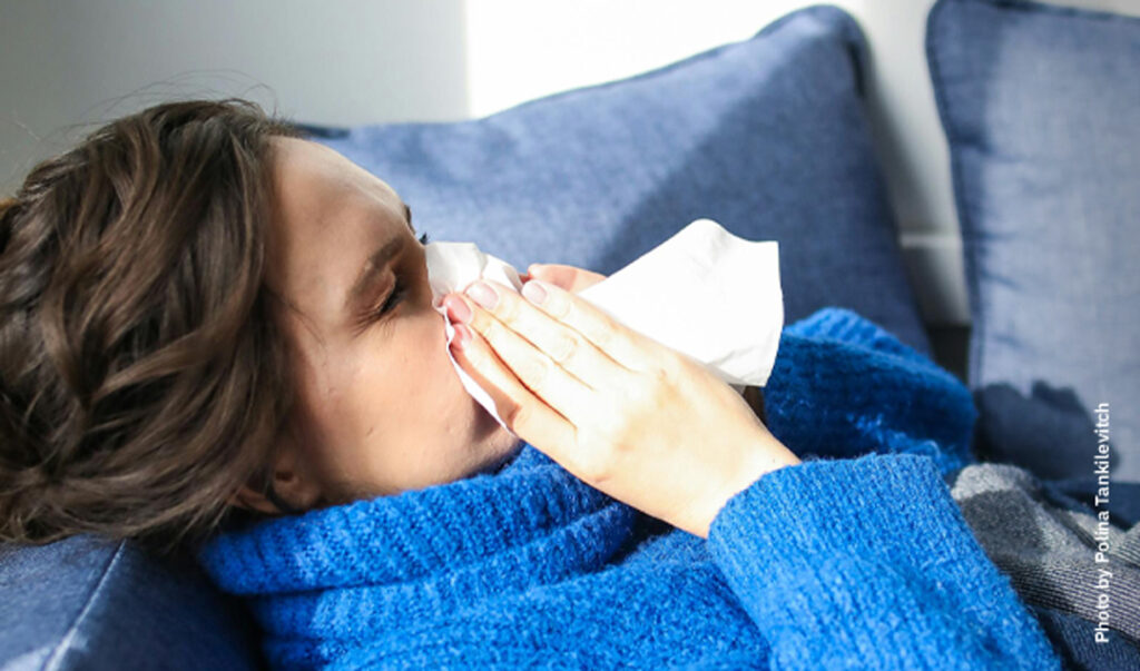 Woman sneezing